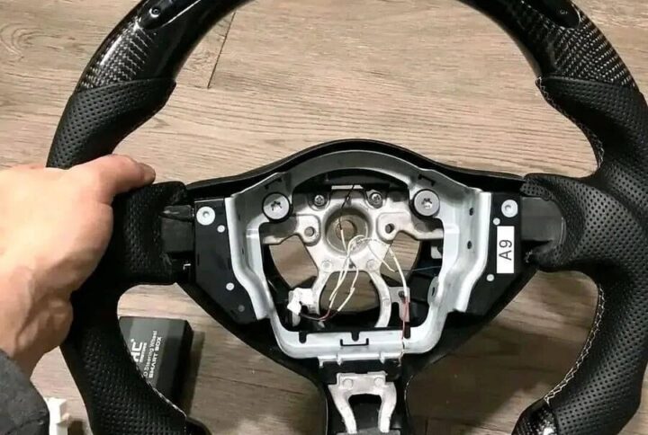 OHT Motors Carbon fiber White Stitching steering wheel.